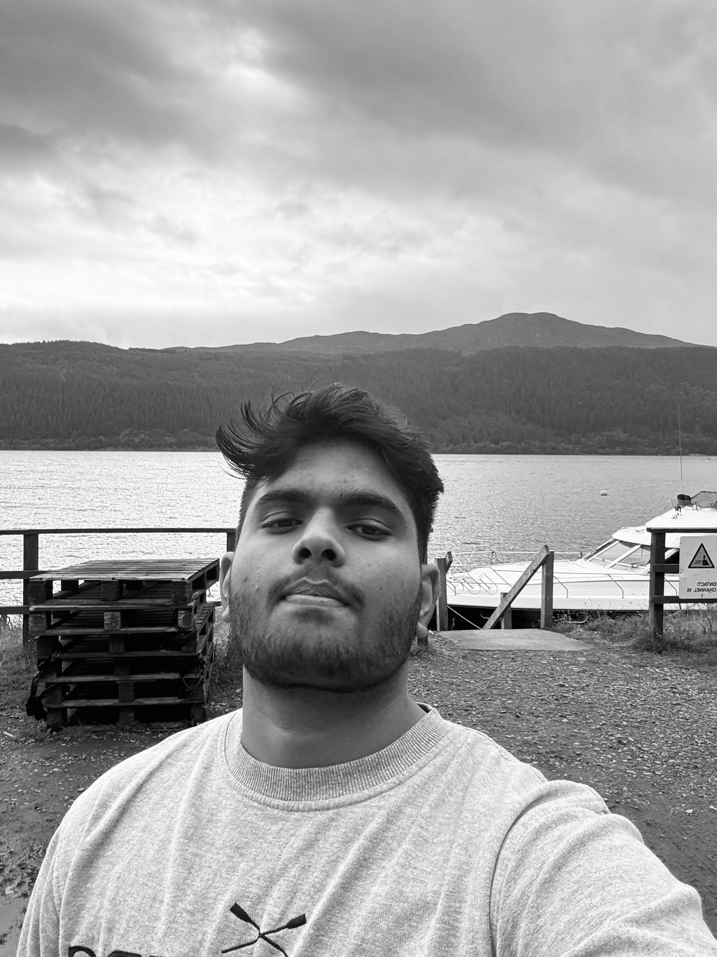 Portrait of Aryan by a lake